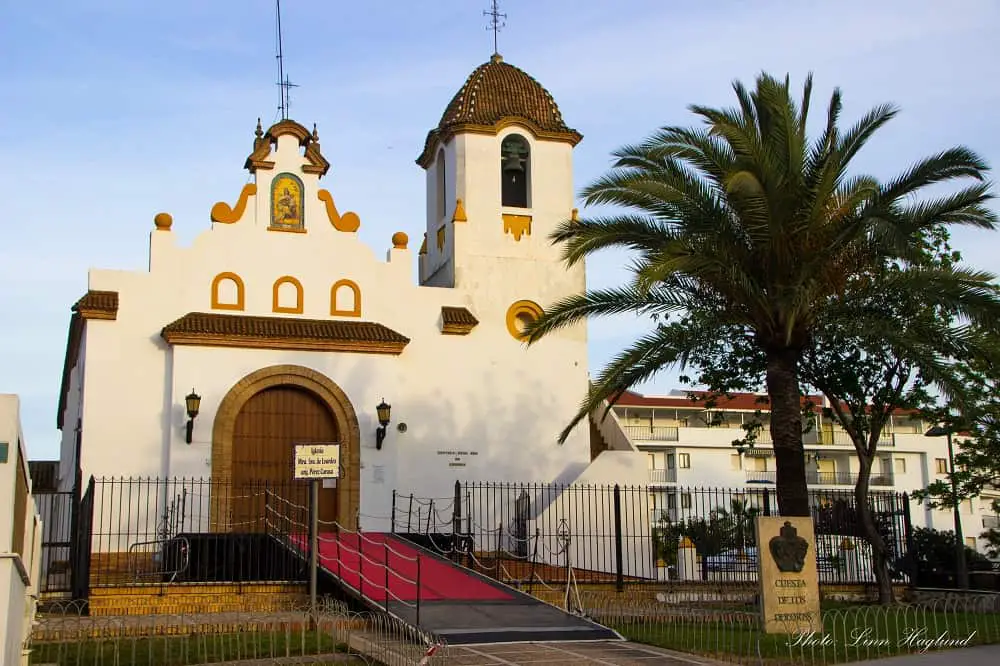 Our Lady of Lourdes Chapel - A white Andalusian church