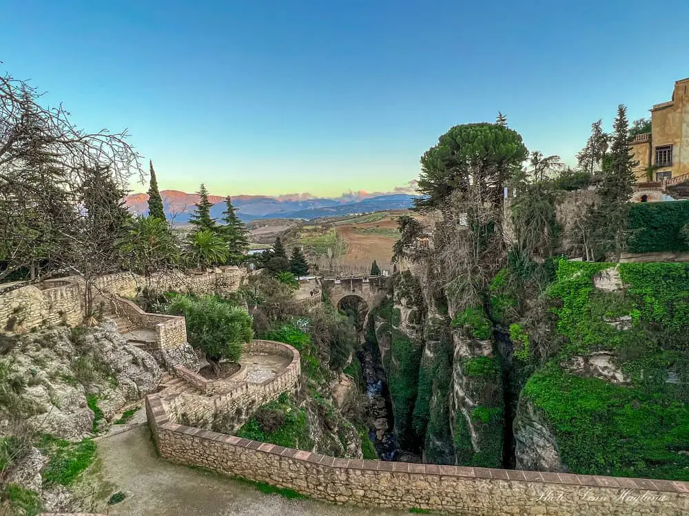 Sightseeing in Ronda Spain along the Jardines de Cuenca gardens where stoney pathways lead to several viewpoints overlooking the unterior of El Tajo Gorge.