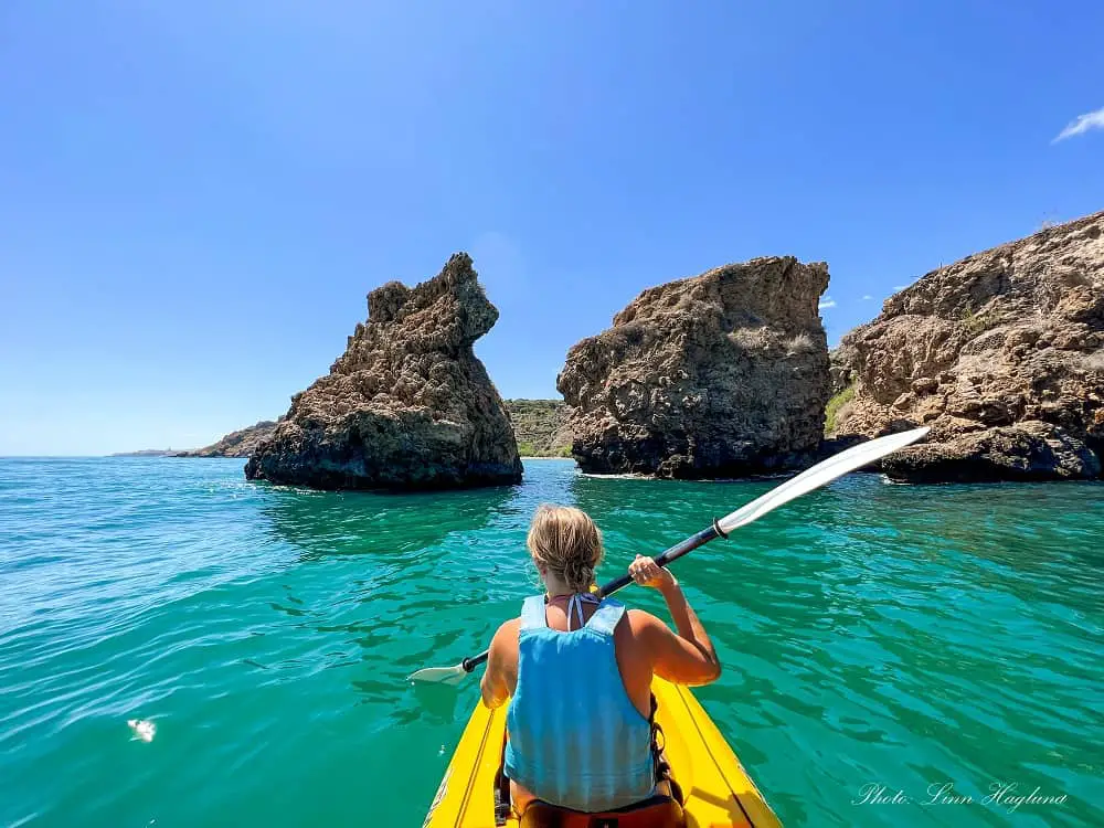 Me kayaking in Nerja towards rock formations which is one of the most fun activities in Costa del Sol 