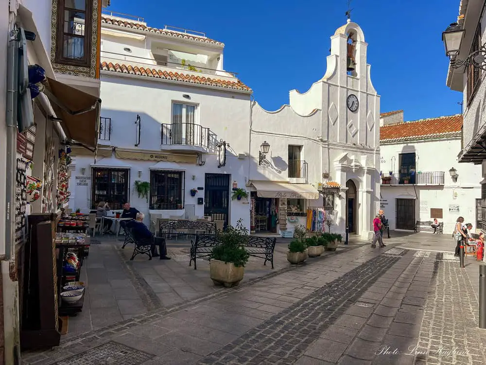 Square in Mijas with a white church.