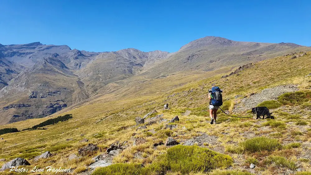 Hiking in Sierra Nevada Spain in a vast montaneous landscape.