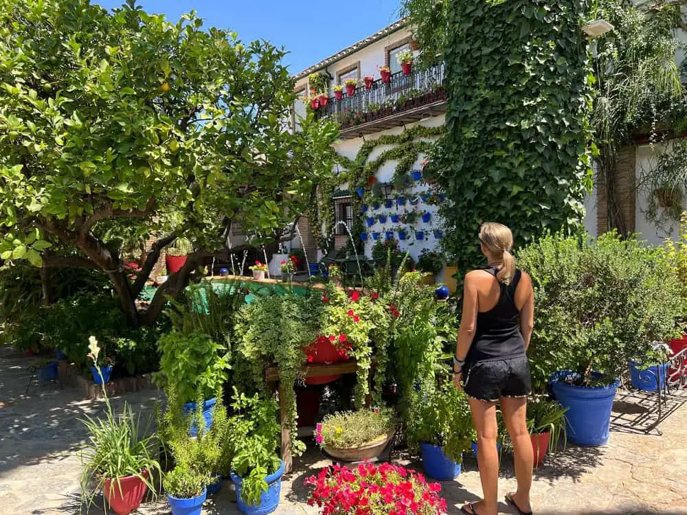 Me looking at a fountain in a patio in one of the towns around Cordoba.