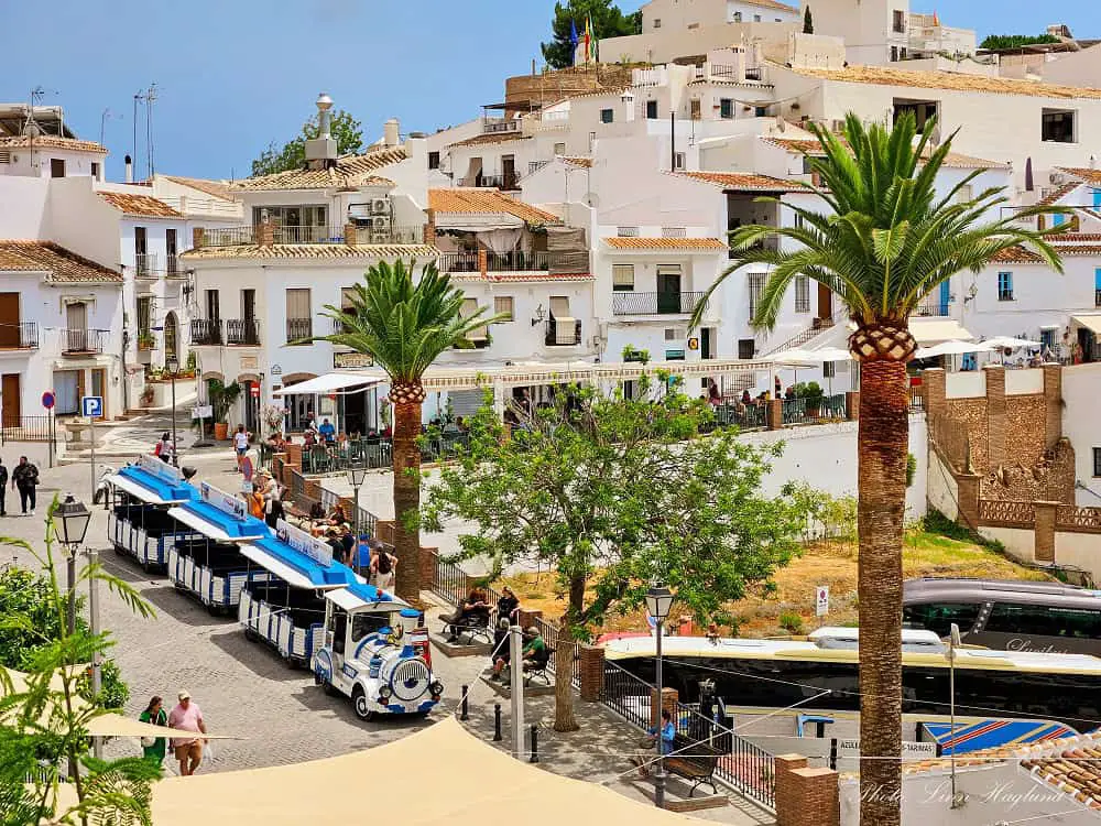 Buses and tourist train in Frigiliana.