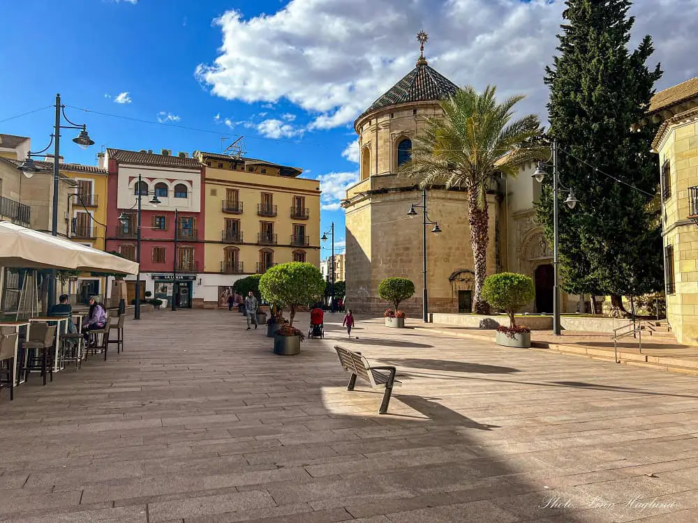 Colorful houses, restaurants, and a octangular tower at Plaza San Miguel in Lucena.