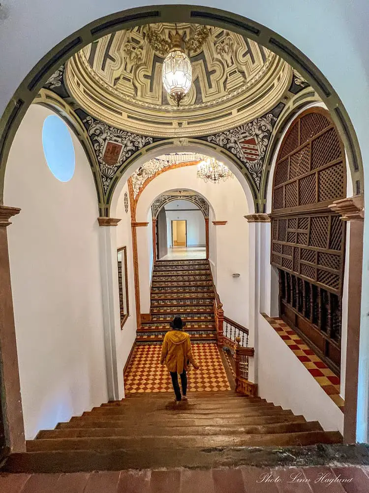 Me walking down the stairs in Palacio de Los Condes de Santa Ana Lucena.