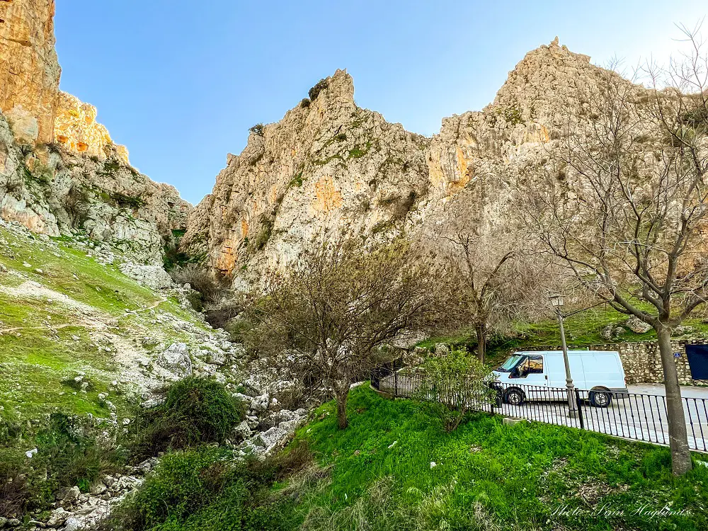 Zuheros parking spots at the foothills of steep mountains.