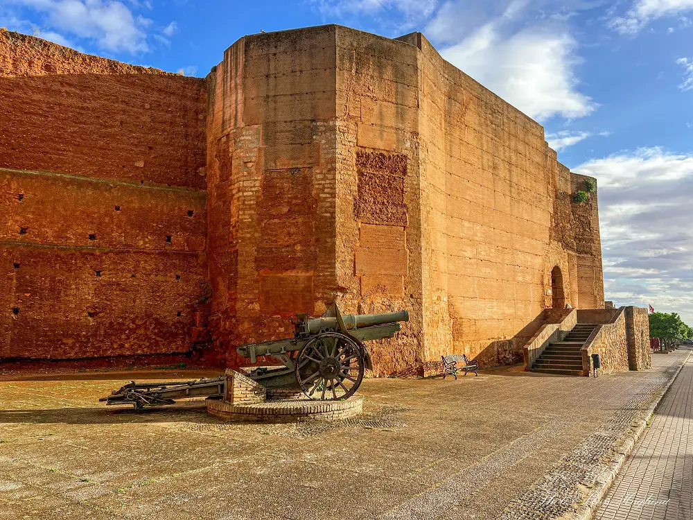 Niebla city walls with a canon in front of it.