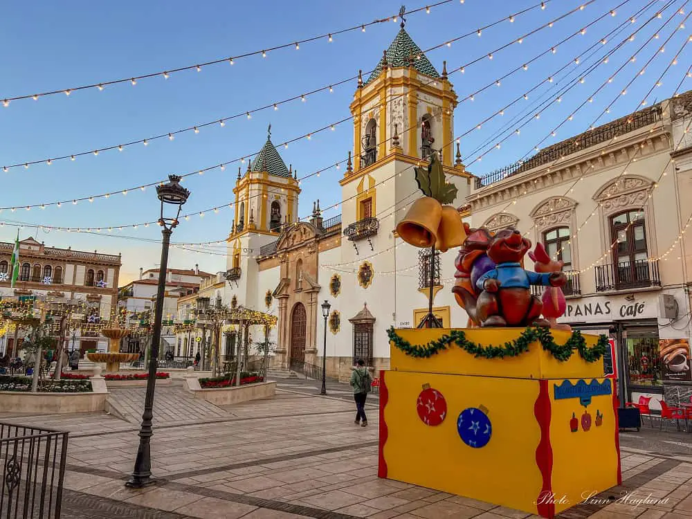 Lights and decorations on a square in Ronda in winter.