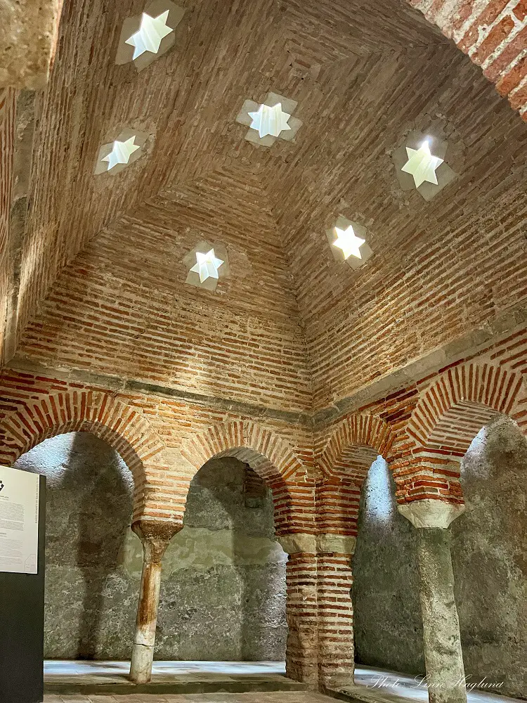 Arab Baths with natural light coming in star shaped holes in the ceiling - visiting is one of the best things to do in Baza Spain.