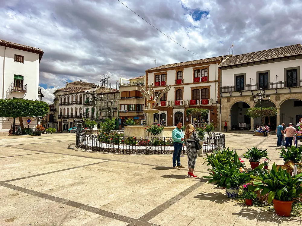 People walking around a Baza square.